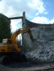 Parbold - Close up of wheeled excavator breaking up concrete.